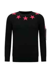 Zwarte trui met felroze stervormige versieringen op de borst, een ronde hals en een ritssluiting op de mouw.