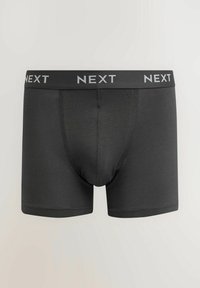 Crne bokserice izrađene od mekog materijala s uskim fitom. Imaju široku elastičnu traku s "NEXT" logom u srebrnoj boji.