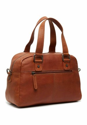 Brown leather handbag with two sturdy handles, rounded shape, top zipper closure, and a front exterior pocket with a zipper detail.