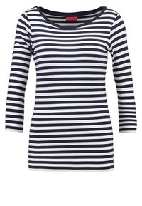 Haut à rayures bleu marine et blanc à manches longues avec un col rond et une coupe ajustée. Fabriqué en tissu doux et extensible.