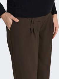 Brown tailored pants with a smooth texture, featuring a flat front and side pockets. The fabric appears lightweight and slightly stretchy.