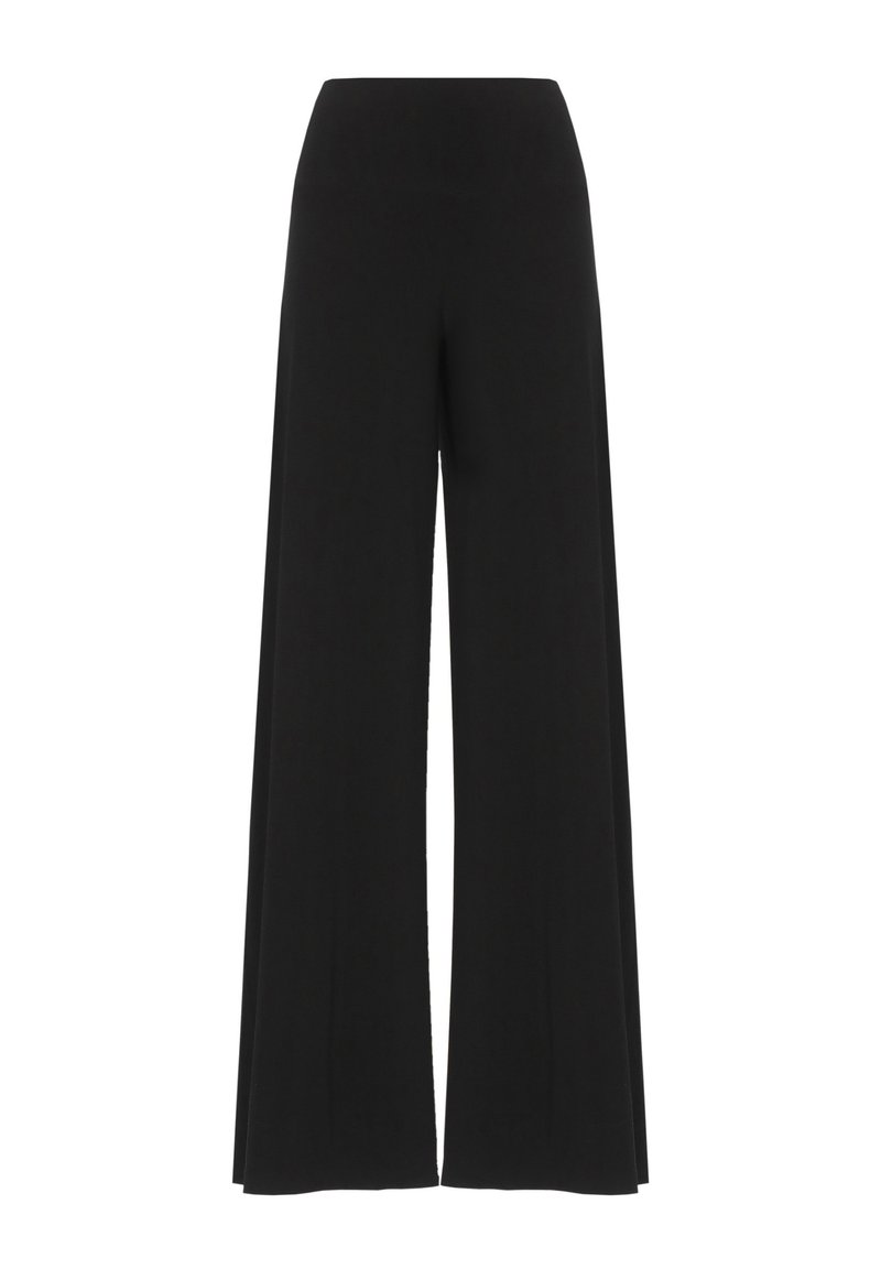 Pantalon noir à jambes larges avec une taille haute, confectionné en tissu extensible. Il présente une texture lisse et une silhouette fluide et longue.