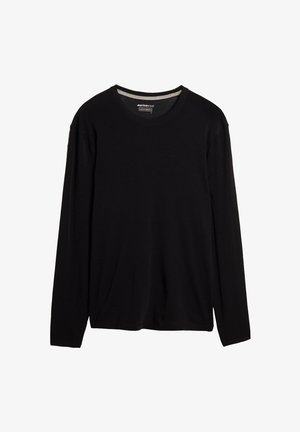 Czarny longsleeve z wełny merino. Posiada okrągły dekolt i gładką teksturę, z luźnym krojem i bez widocznych wzorów.