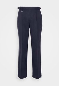Pantalon bleu marine foncé sur mesure avec des boucles latérales ajustables et une coupe droite et près du corps.