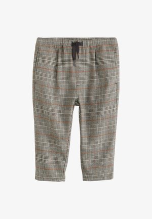 Pantalon à carreaux gris avec des lignes orange, taille élastique et cordon noir, longueur raccourcie.