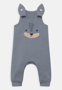 Szare bawełniane ogrodniczki z nadrukiem twarzy misia, z zatrzaskami na dole oraz miękkimi ramiączkami w kształcie uszu dla dodatkowego akcentu.