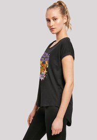 Black cotton t-shirt with a crew neckline and short rolled sleeves. Features a colorful graphic print on the front with animated characters.