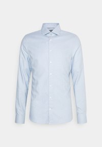 Light blue long-sleeve shirt featuring a buttoned collar, subtle check pattern, and white buttons. Fabric appears smooth with structured fit.