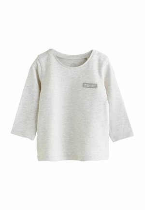 Heleda hall värvitud pikad varrukad särk pehmest puuvillast, ümaral kaelusel ning õmmeldud sildiga, kus on kirjas "Little Star". Kaks nööpi õlal.