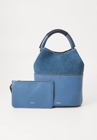Blue leather handbag with a soft suede top, round handle, and a matching zippered pouch. Features visible stitching and brand logo.