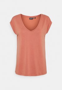 T-shirt a maniche corte, con scollatura a V, di un morbido colore corallo tenue. Realizzato in tessuto leggero con una vestibilità rilassata e orlo semplice.