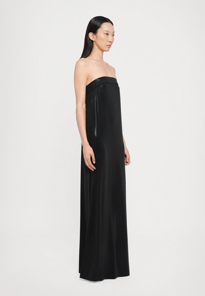Black strapless maxi dress with a smooth, glossy texture. Features a fitted bodice and flowing skirt, reaching the ankles.