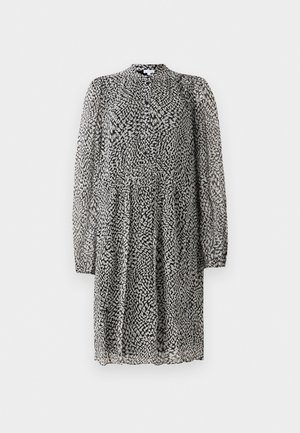 Čierno-biela sukňa po kolená s dlhými priesvitnými rukávmi, zapínaním na gombíky vpredu, voľným strihom a abstraktným bodkovaným vzorom na ľahkej látke.