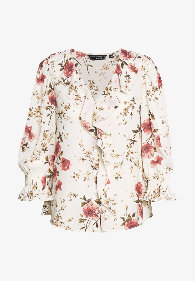 Blusa bianca floreale con rouches, caratterizzata da motivi floreali rossi e beige. Maniche lunghe a palloncino con polsini arricciati e chiusura frontale con bottoni.