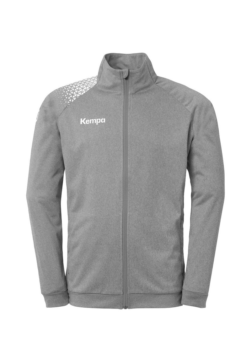 Gray zip-up jacket with a textured pattern on the shoulder, features the brand "Kempa" in white on the chest. Soft fabric and flexible fit.
