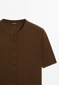 Brown short-sleeve button-up knit top with round neckline and seven small buttons down the front.