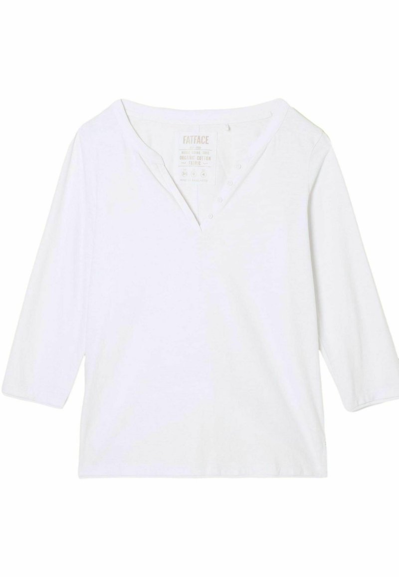 Weißes Oberteil aus Bio-Baumwolle mit V-Ausschnitt und dreiviertellangen Ärmeln. Verfügt über sichtbare Knopfakzente und einen geraden Saum.