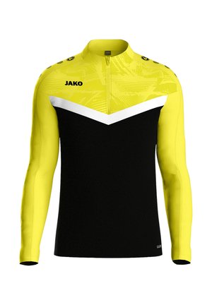 Maglietta sportiva a maniche lunghe con corpo nero, maniche e parte superiore gialle, design a chevron bianco e una cerniera corta. Logo del marchio sul fronte.