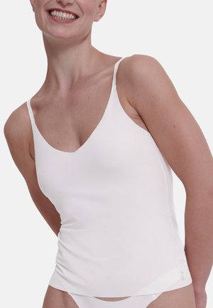 White camisole with thin straps, made of smooth fabric. Features a V-neckline, fitted design, and gathers at the waist for a subtle texture.