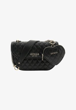 Black quilted handbag with gold accents, featuring a detachable heart-shaped pouch and a crossbody strap. Logo displayed prominently.