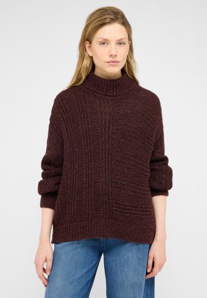 Burgunderfarbener Strickpullover mit hohem Kragen, strukturierten Mustern und umgeschlagenen Bündchen. Dickes, warmes Material mit lockerer Passform.
