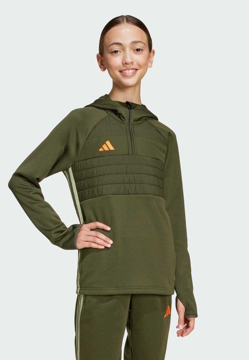 Green athletic hoodie with a zippered front, textured yoke, and orange logo. Smooth fabric and fitted design, paired with matching pants.
