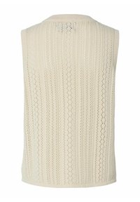 Koftan utan ärmar i mjuk creamfärg med vertikal ribbstruktur och texturerad öppen väv. Rundad halsringning och subtila fålldetaljer.