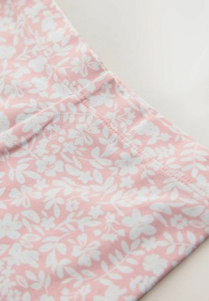 Light pink fabric with a white floral pattern featuring leaves and flowers, stitched edges, and a smooth texture.