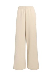 Béžové nohavice s širokými nohavicami a elastickým pásom. Vyrobené z mäkkého materiálu, so malým logom na boku. Vhodné na bežné nosenie.