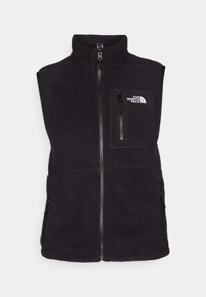 Melnas vilnas vestes ar augstu apkakli, priekšējo rāvējslēdzēju, sānu kabatām un krūšu kabatu, kurā ir North Face logo. Mīksta tekstūra, bez piedurknēm.
