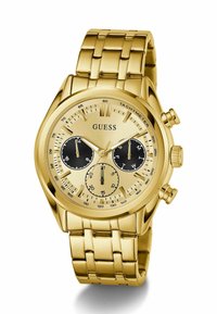 Montre chronographe en métal doré avec un bracelet à maillons, dotée d'un cadran doré avec des sous-cadrans noirs et des marquages de tachymètre.