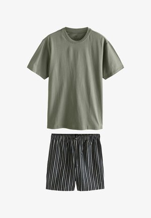 Olive green short-sleeve crew neck t-shirt paired with black and white vertically striped drawstring shorts.