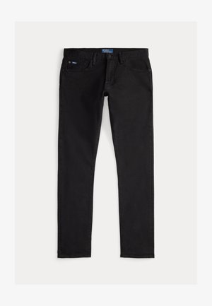 Vaqueros negros de mezclilla con un ajuste slim, que cuentan con cinco bolsillos, trabillas para cinturón y una etiqueta azul de la marca en la cintura. Tejido liso y duradero.