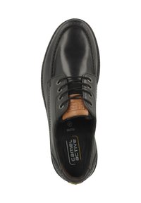Scarpa in pelle nera con punta tonda, design con lacci, colletto imbottito e soletta beige a contrasto. Marchio "Camel Active" ben visibile all'interno.
