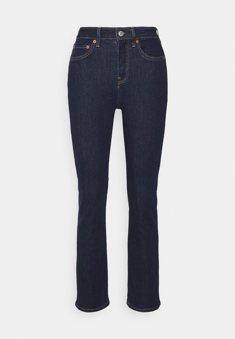 Jeans bleu foncé à jambes droites avec bouton à l'avant, fermeture éclair et design cinq poches sur un fond clair uni.