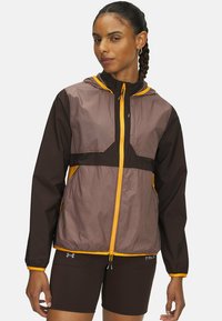 Brown and purple lightweight jacket with a hood, features yellow accents and a zippered front. Made from a smooth, water-resistant material.