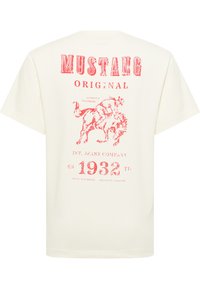 T-shirt en coton crème avec une grande impression graphique rouge d'un cheval et du texte, à manches courtes et col rond.