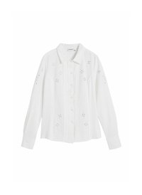 Camicia bianca a maniche lunghe realizzata in tessuto leggero con chiusura a bottoni, caratterizzata da ricami floreali e colletto classico.