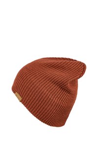 Rust-colored knit beanie with a ribbed texture, slouchy design, and a small branded tan label on the side.