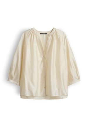 Cream-colored, lightweight blouse with long puffed sleeves, V-neckline, and front button closure, displayed on a white background.