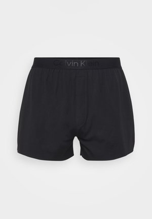 Shorts de boxeur pour hommes noirs avec taille élastique, arbore le logo Calvin Klein, avec une braguette avant et une construction en tissu lisse.