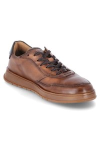 Brown leather sneaker with textured upper, contrasting black heel accent, and dark laces. Rubber sole with subtle traction pattern.