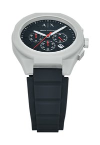 White silicone watch with a black dial, red accent details, and chronograph subdials. Features a segmented black rubber strap.