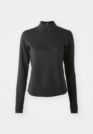 Musta pitkähiainen pullover, joka on valmistettu joustavasta materiaalista. Siinä on pystykaulus ja neljännesvetoketju edessä. Sujuva pinta ja istuva muotoilu.