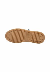 Rubber shoe sole with a textured, ridged pattern. Light brown color with a smooth finish and a slight curve at the toe area.