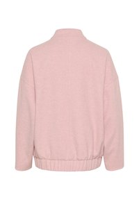 Hanorac roz cu guler înalt, umeri căzuți și tiv elastic. Fabricat dintr-un material moale cu o finisare ușor texturată.