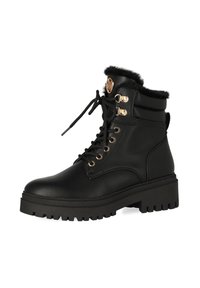 Zwarte leren enkellaarsjes met faux fur voering, ronde neus, chunky zool, gouden hardware accenten en vetersluiting.