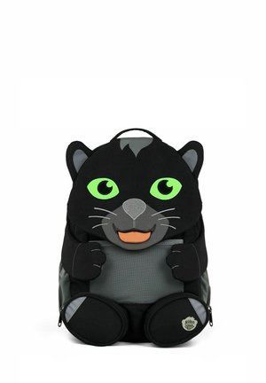 Black backpack designed as a smiling cartoon panther with bright green eyes, gray nose, whiskers, and small front paws.