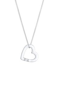 Collana con pendente a forma di cuore in argento, caratterizzata da un accento in zirconia cubica. Il design della catena è semplice, con una finitura lucida e una forma di cuore aperto.