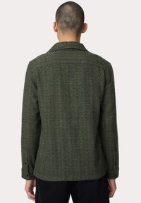Olivgrüner Wollmischungsjacke mit strukturierter Oberfläche, mit Reverskragen und geknöpften Manschetten, ausgestattet mit einem schlichten Rückendesign.